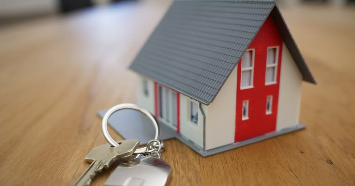 House model with keys — Airbnb insurance and property protection in Denmark