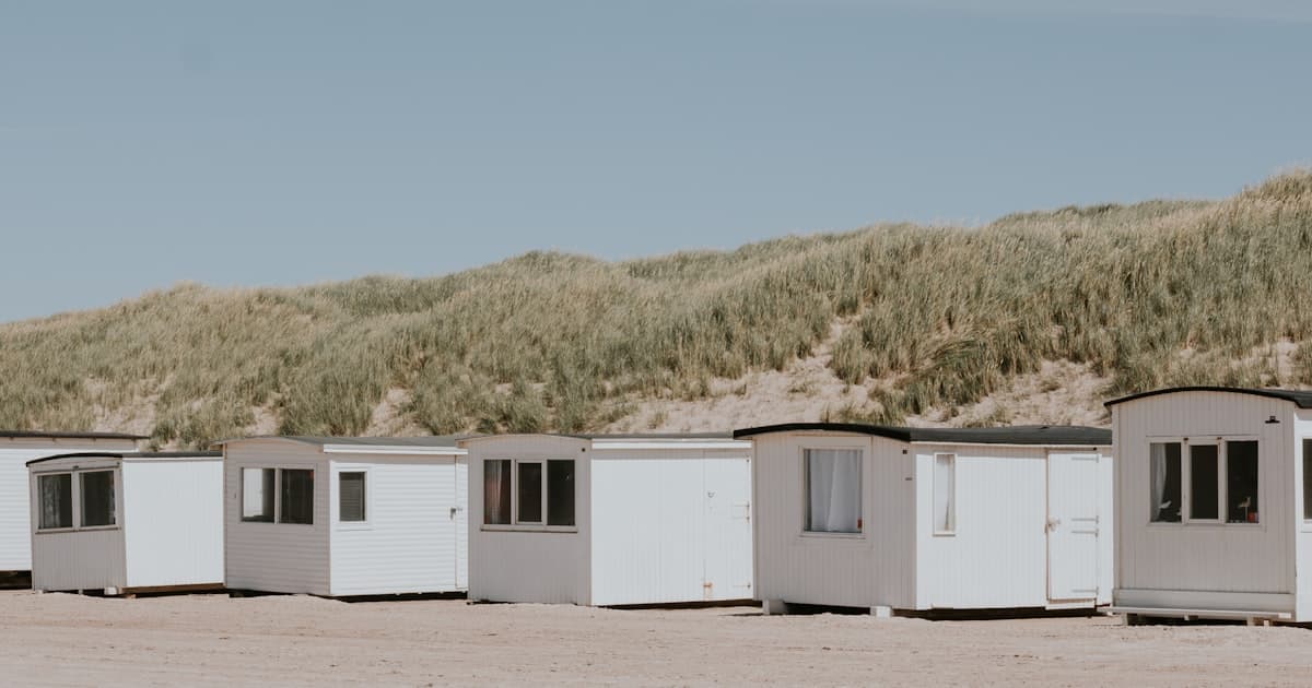 Colourful beach huts on the Danish west coast — holiday rental destination